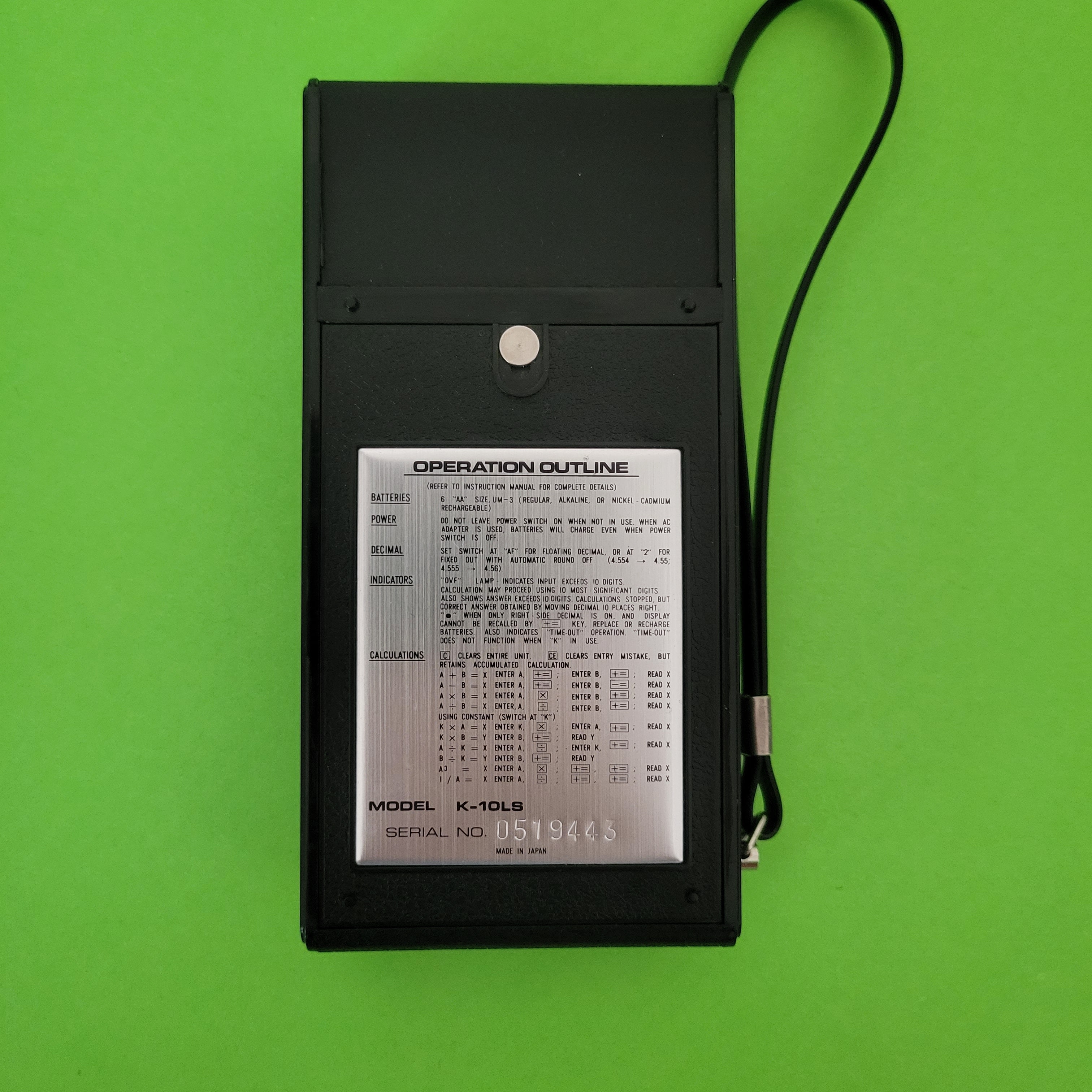 An image of the back of a I.T.C. four function + calculator
